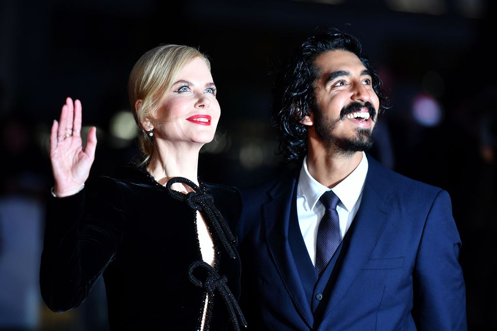 Australian actress Nicole Kidman (L) and British actor Dev Patel pose on the red carpet after arriving to attend a gala screening of the film 