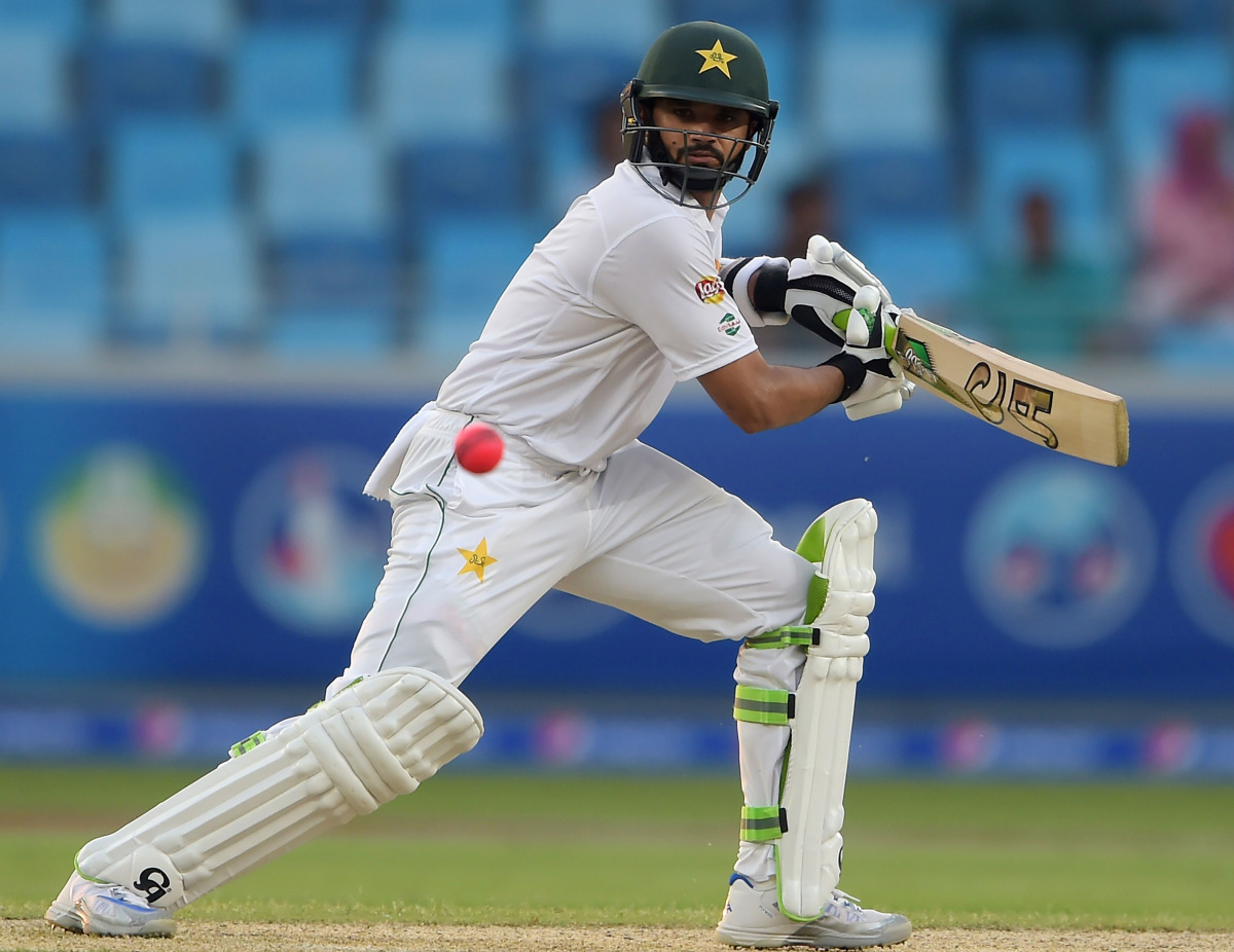 Pakistani batsman Azhar Ali plays a shot on the opening day of the first day-night Test between Pakistan and the West Indies at the Dubai International Cricket Stadium in the Gulf Emirate on October 13, 2016. (AFP / Aamir Qureshi)