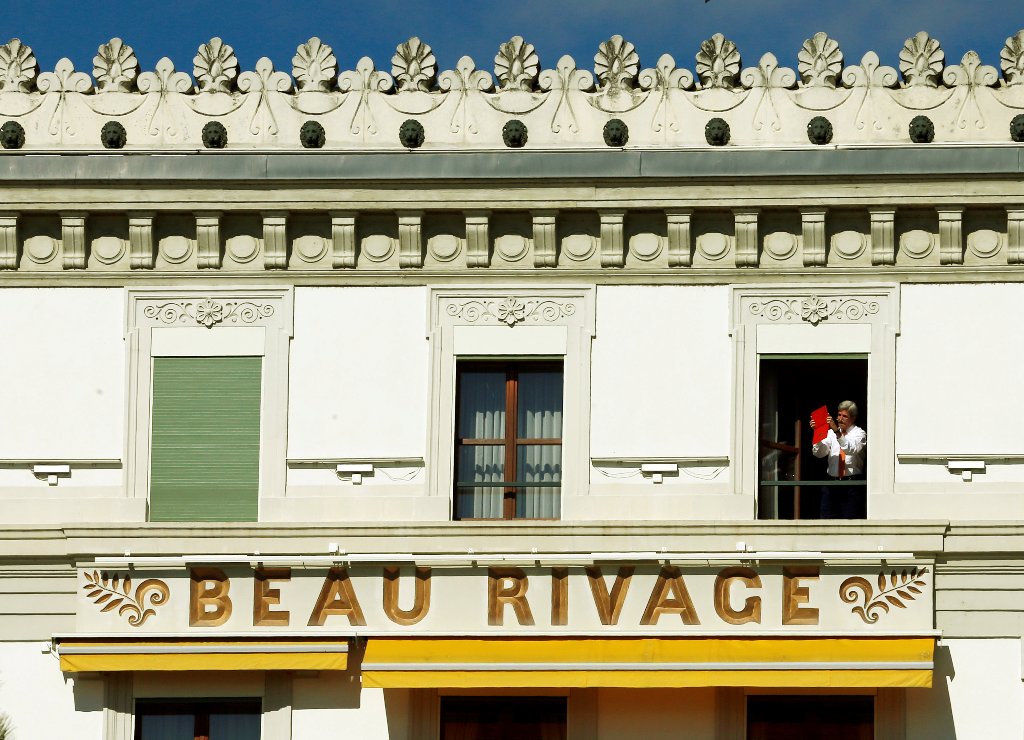 U.S. Secretary of State John Kerry takes a picture with his mobile device from his hotel room at the Beau-Rivage Palace ahead of Syria talks in Lausanne, Switzerland, October 15, 2016. REUTERS/Denis Balibouse