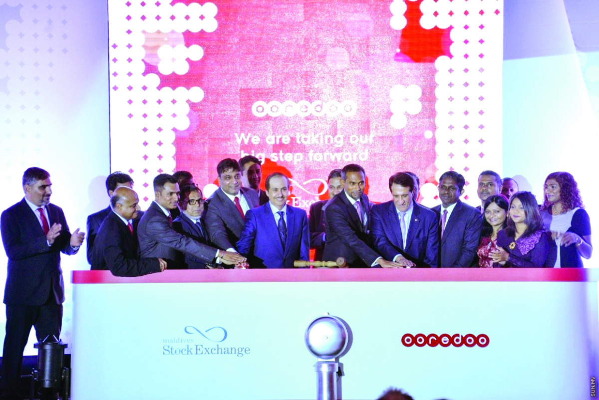 Sheikh Abdulla bin Mohammed bin Saud Al Thani (seventh right), Chairman of Ooredoo Group, with other officials during the bell ceremony at the Maldives Stock Exchange.