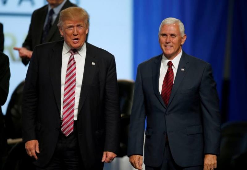 File photo of Republican vice presidential candidate Mike Pence with the Presidential candidate Donald Trump. Reuters 