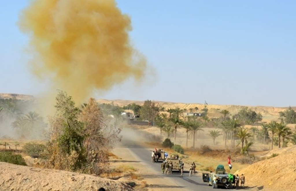 In this photo taken on Monday, Oct. 10, 2016, Iraqi army soldiers clear the roads from roadside bombs after defeating ISIS extremists from villages outside Ramadi, 70 miles (115 kilometers) west of Baghdad, Iraq. (AP Photo)