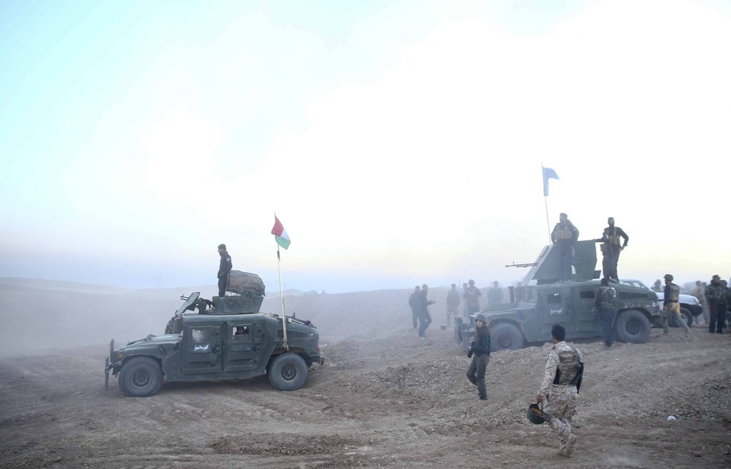 Peshmerga forces stand guard at Hazer region's Wardak village during an operation to retake Iraq's Mosul from Deash in Iraq on October 17, 2016. A much anticipated Mosul offensive to liberate the city from Daesh began midnight Sunday, according to Iraqi P