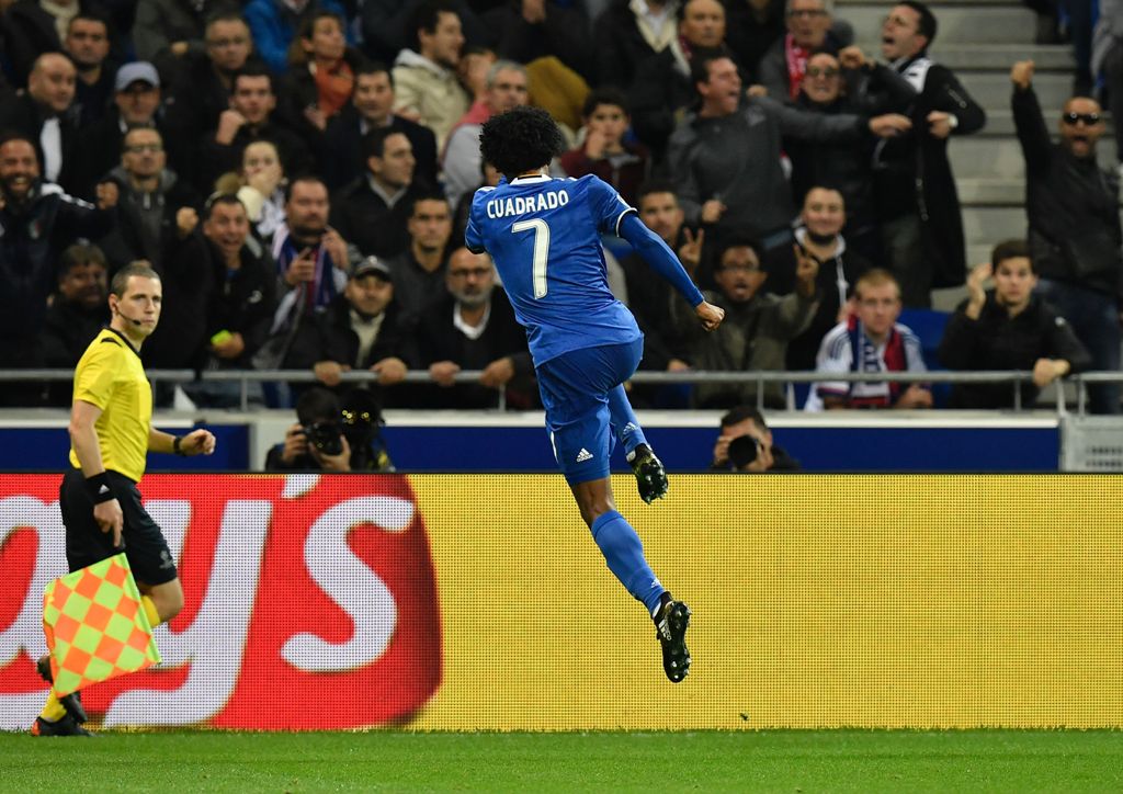 Juventus' Colombian forward Juan Cuadrado celebrates after scoring a goal during the Champions League football match between Olympique Lyonnais and Juventus on October 18, 2016 at the Parc Olympique Lyonnais stadium in Decines-Charpieu near Lyon, southeas