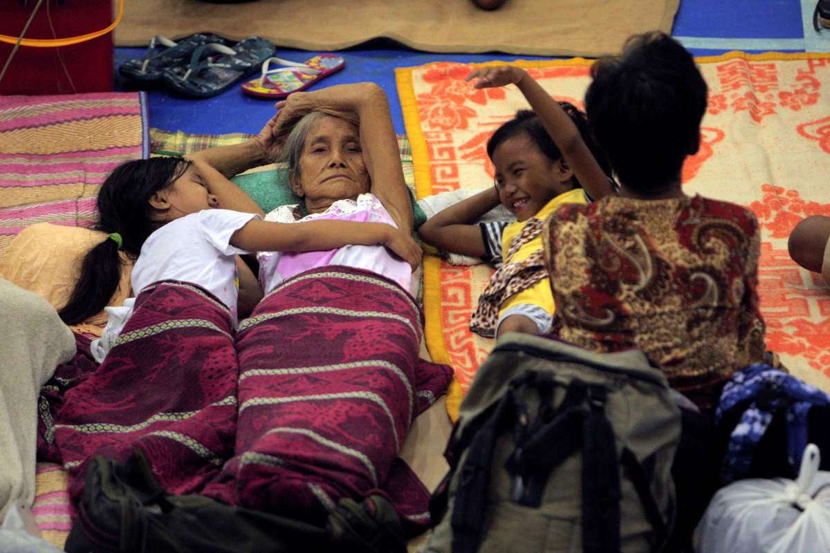 Evacuees from the coastal villages take shelter inside an evacuation center as Typhoon Haima locally name Lawin approaches, in Alcala town, Cagayan province, north of Manila October 19, 2016. REUTERS