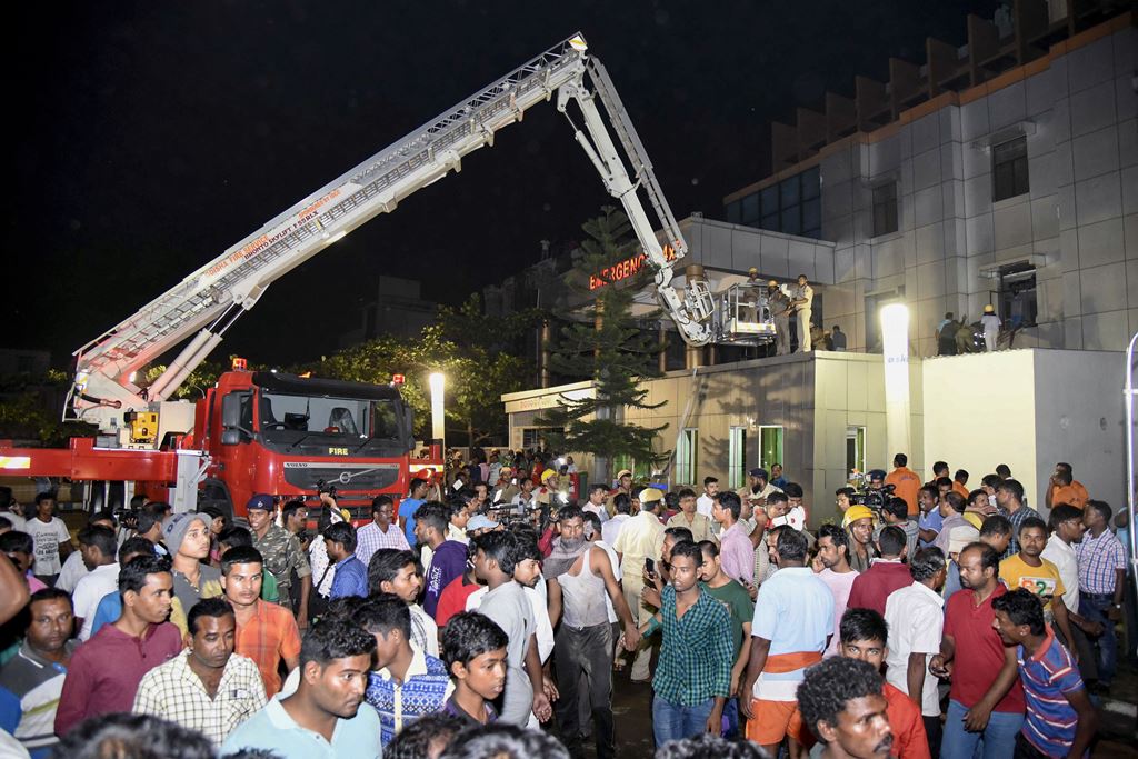 Indian rescue workers trying help victims of a massive fire at the SUM hospital building in Bhubaneswar, the capital of coastal Odisha state. AFP