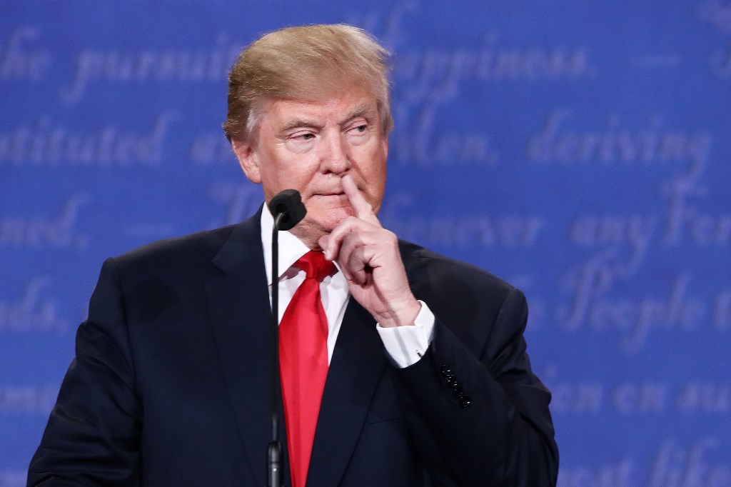 Republican presidential nominee Donald Trump gestures as he speaks during the third U.S. presidential debate at the Thomas & Mack Center on October 19, 2016 in Las Vegas, Nevada. Win McNamee/Getty Images/AFP