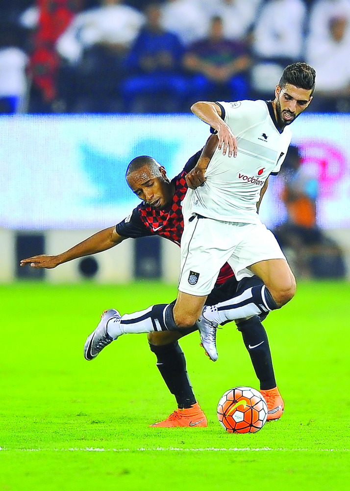 Al Sadd’s Hassan Khalid Al Haydos (right) vies for the ball with Al Rayyan’s player during their first semi-final of the Emir Cup football tournament played at the Jassim Bin Hamad Stadium, in Doha, in this file photo of May 21, 2016.