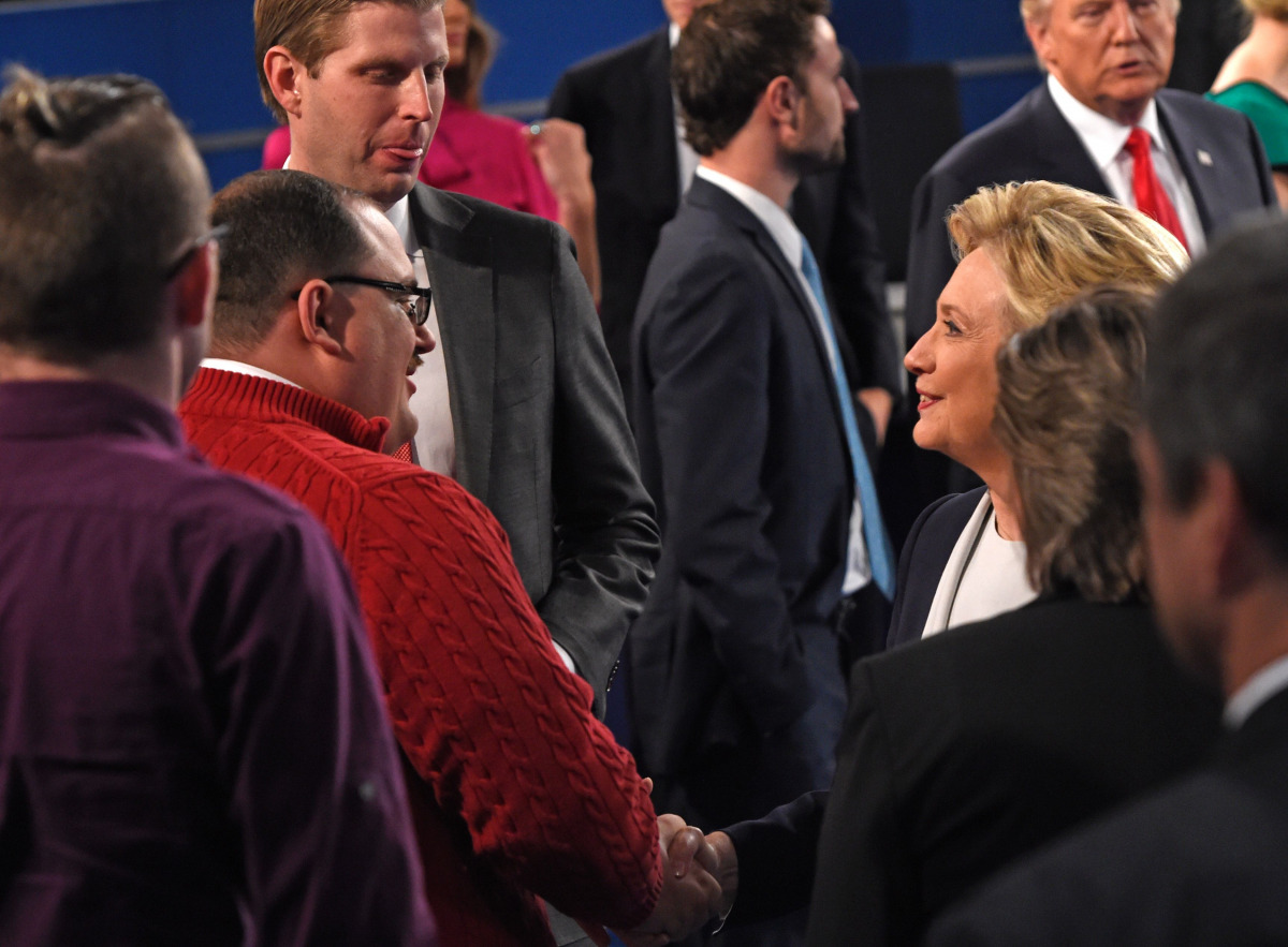Hillary Clinton shakes hands with Ken Bone following the second presidential debate with Republican nominee Donald Trump at Washington University. (AFP)