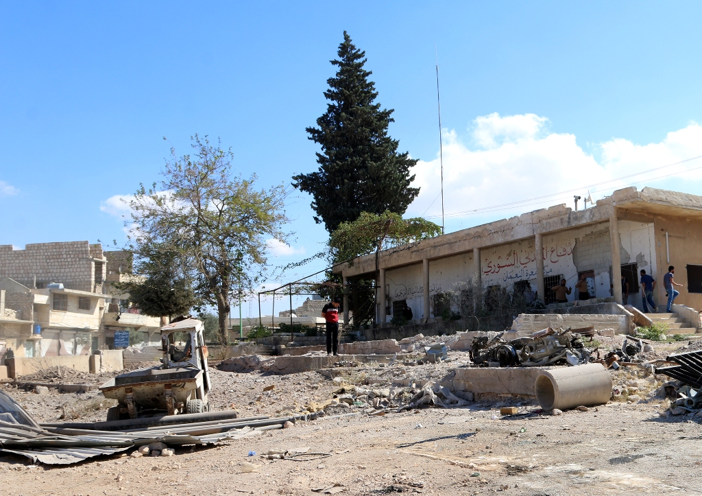 (FILE PHOTO) Syrians inspect the destroyed buildings after warcrafts belonging to the Russian and Syrian army carried out an air strike on a civil defense centre in Maret el Numan district of Idlib, Syria on October 20, 2016. ( Muhammed Karkasa - Anadolu 