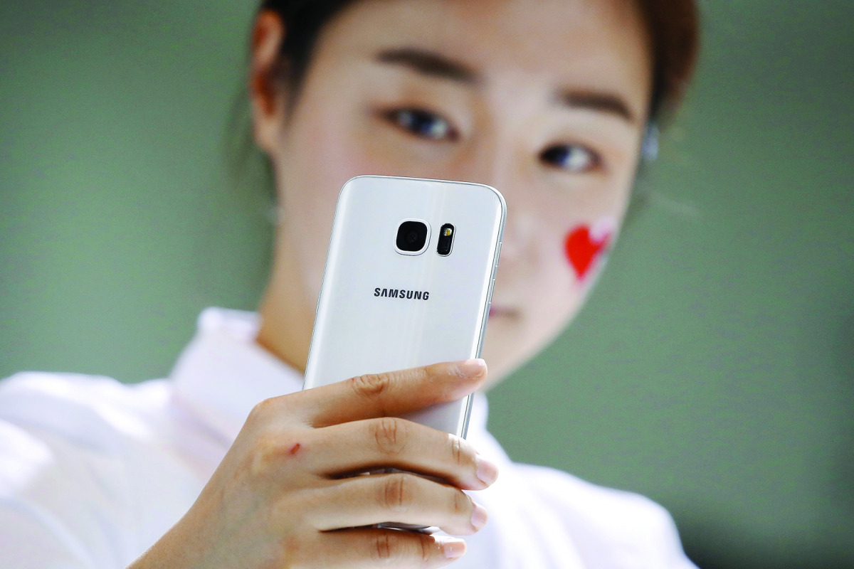 A model demonstrates a Samsung Electronics’ new smartphone Galaxy S7 during its launching ceremony in Seoul, South Korea. 