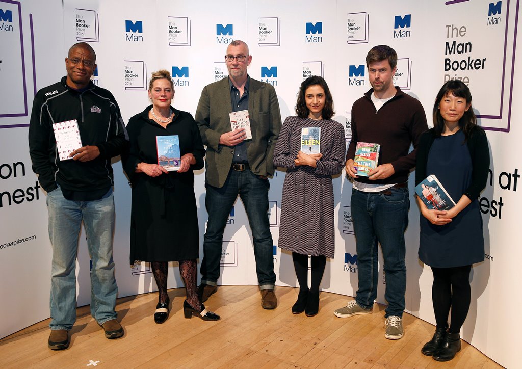 The six Man Booker shortlisted fiction authors, (L to R) Paul Beatty, Deborah Levy, Graeme Macrae Burnet, Ottessa Moshfegh, David Szalay and Madeleine Thien, pose with their books, during a photo-call on the eve of the prize giving in London, Britain Octo