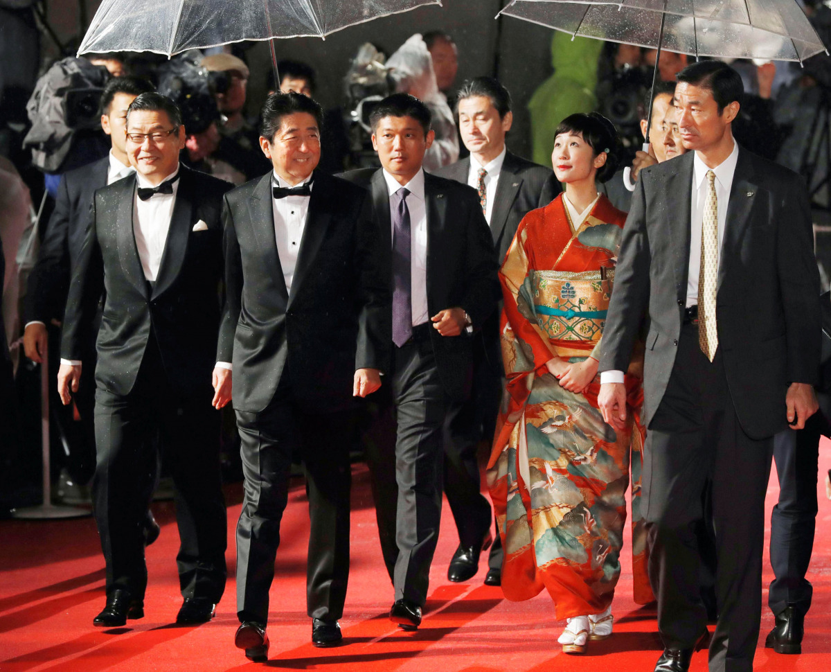 Japan's Prime Minister Shinzo Abe, (3rd L), accompanied by kimono-clad Japanese actress Haru Kuroki, arrive for the opening ceremony of the Tokyo International Film Festival in Tokyo, Japan October 25, 2016. (Kyodo/via REUTERS)
