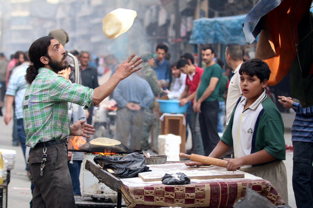 A man makes bread in the rebel held besieged Aleppo, Syria October 25, 2016. REUTERS/Abdalrhman Ismail