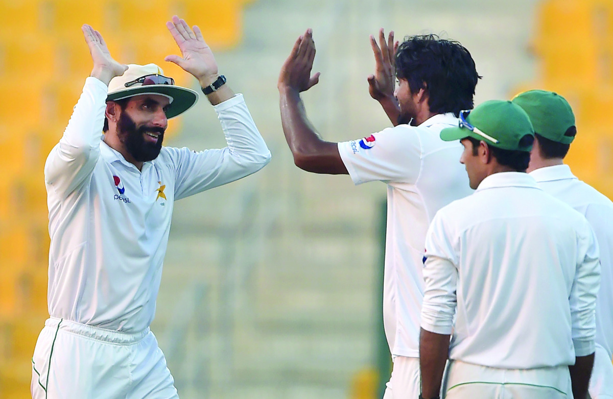 Pakistan captain Misbah-ul-Haq (left) celebrates with bowler Rahat Ali during the second Test against West Indies at the Sheikh Zayed Cricket Stadium in Abu Dhabi.