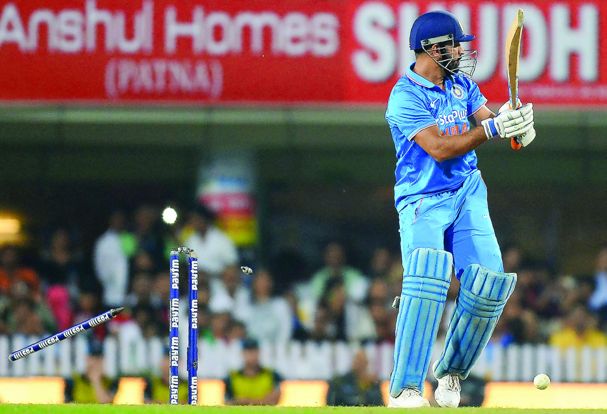 India’s skipper Mahendra Singh Dhoni is bowled out during their fourth one day international match against New Zealand at the Jharkhand State Cricket Association Stadium Complex in Ranchi  yesterday.