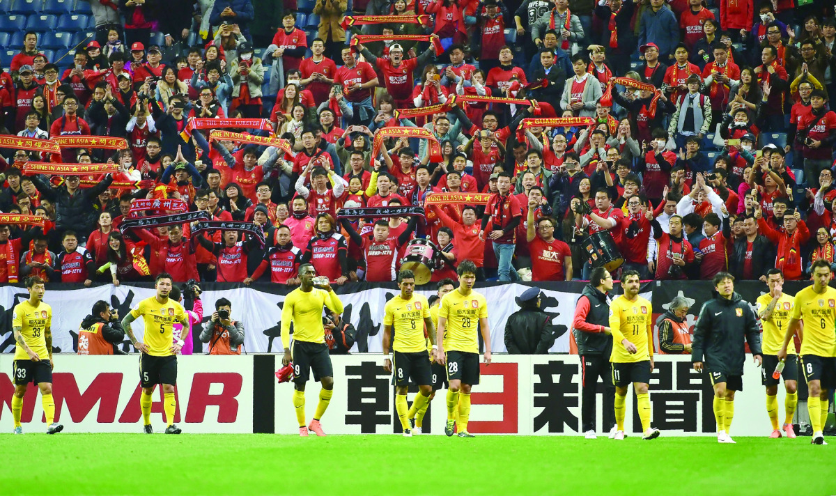 Supporters of China’s Guangzhou Evergrande cheering for their team after the AFC champions league match against Japan’s Urawa Reds in Saitama, Japan in this file photo taken on April 5, 2016.