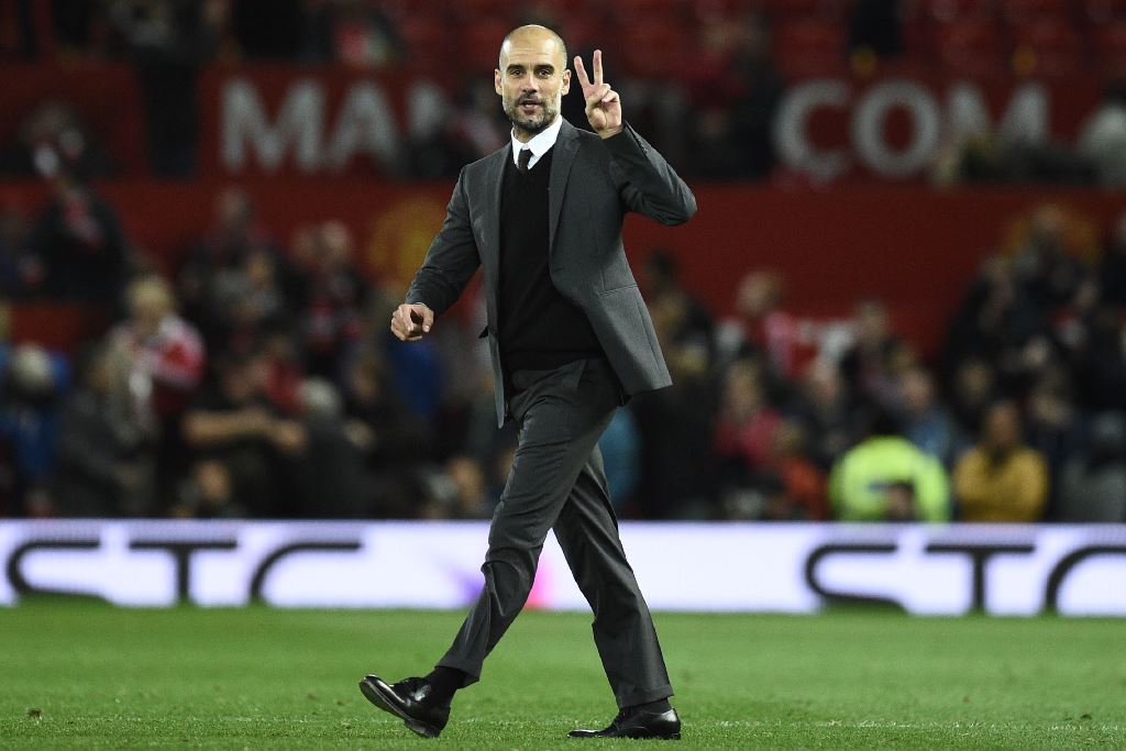 Manchester City's Spanish manager Pep Guardiola gestures on the pitch after the EFL (English Football League) Cup fourth round match between Manchester United and Manchester City at Old Trafford in Manchester, north west England on October 26, 2016. AFP /