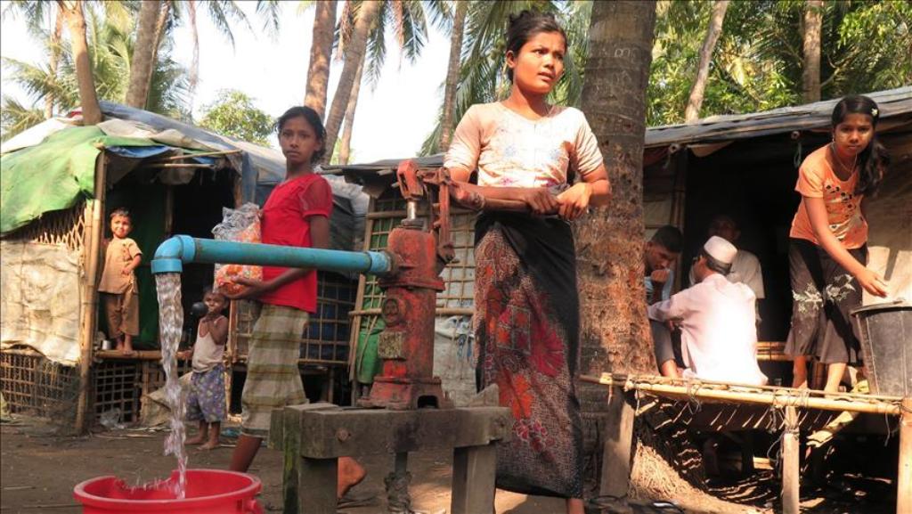 SITTWE, MYANMAR - MAY 2 : Rohingya Muslims pump water at a well in Thet Key Pyin camp near Sittwe, the capital of Rakhine state, Myanmar. ( Sitt Thway Naing - Anadolu Agency )