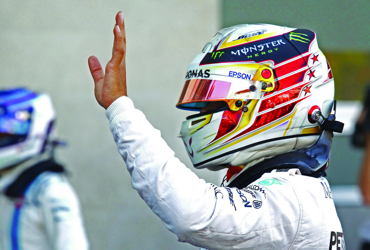 Lewis Hamilton of Britain waves to Formula One fans in Mexico City.