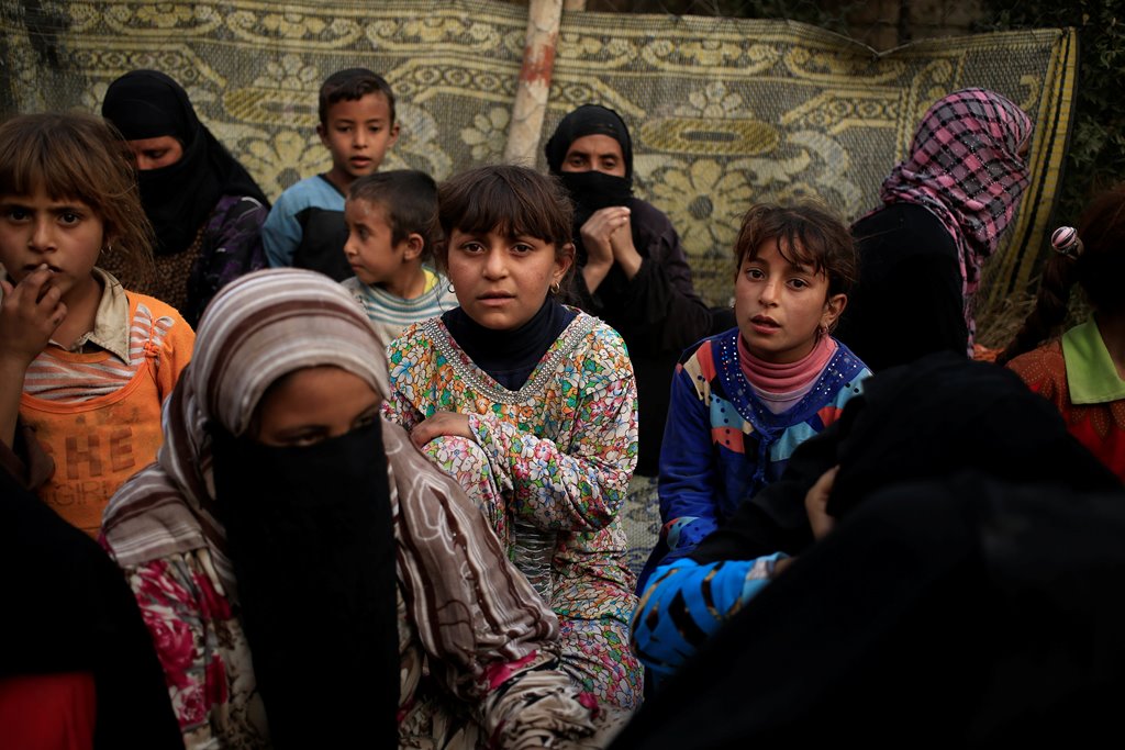 Newly displaced people are pictured at a screening center in Qayyara, south of Mosul, Iraq October 30, 2016. REUTERS/Zohra Bensemra
