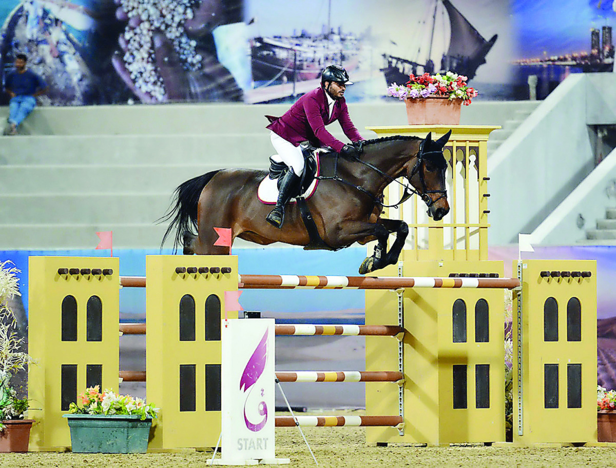 Qatar’s Ali Yousef Al Rumaihi clears a hurdle on the final day of Qatar International Show Jumping Championship at Qatar Racing and Equestrian Club in Doha in this January 2016 file photo.