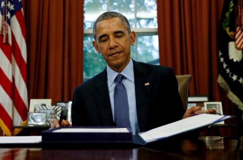 File photo of US President Barack Obama after signing a document. Reuters 