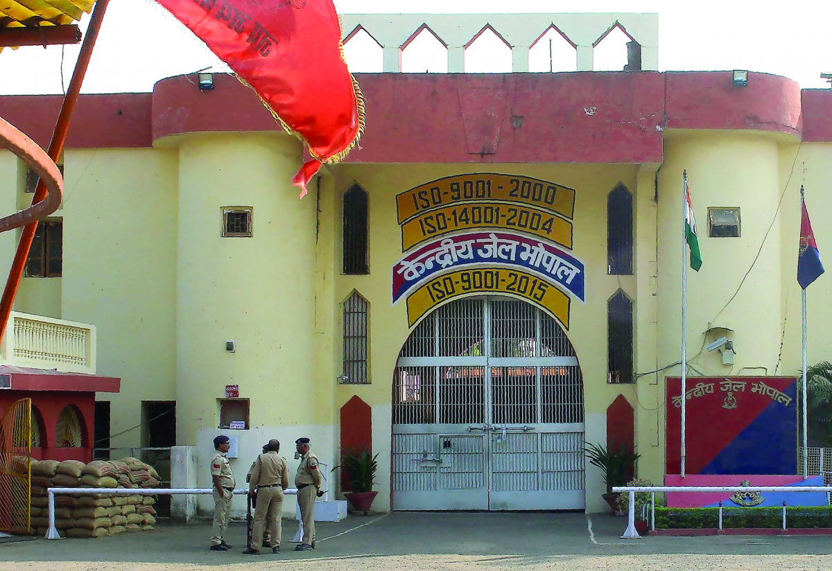 Indian police officials gather at the entrance to The Central Jail in Bhopal on November 1, 2016, a day after some inmates escaped and were killed in an encounter with security personnel. (AFP)