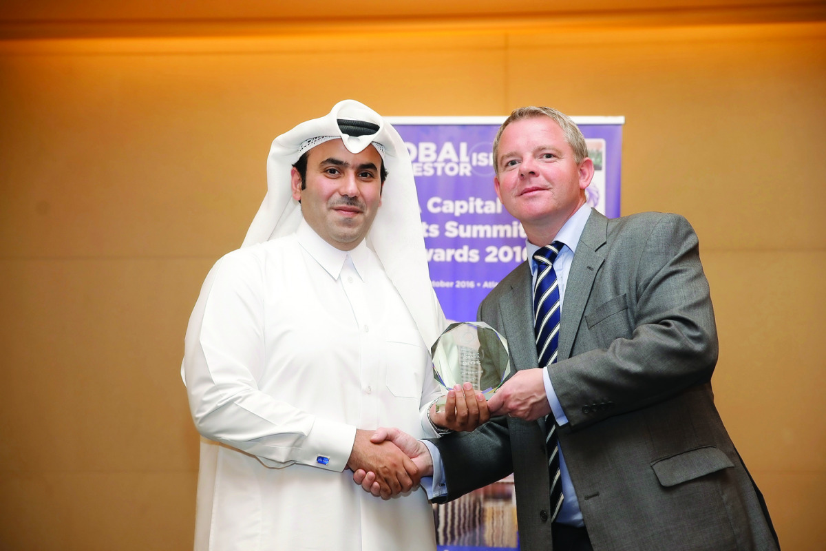 QNB officials receiving Global Investor Magazine awards. 
