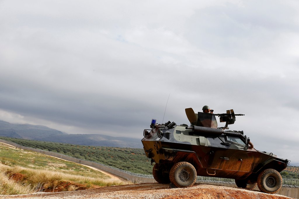 A Turkish soldier on armoured military vehicle patrols the border between Turkey and Syria, near the southeastern village of Besarslan, in Hatay province, Turkey, November 1, 2016. REUTERS/Umit Bektas
