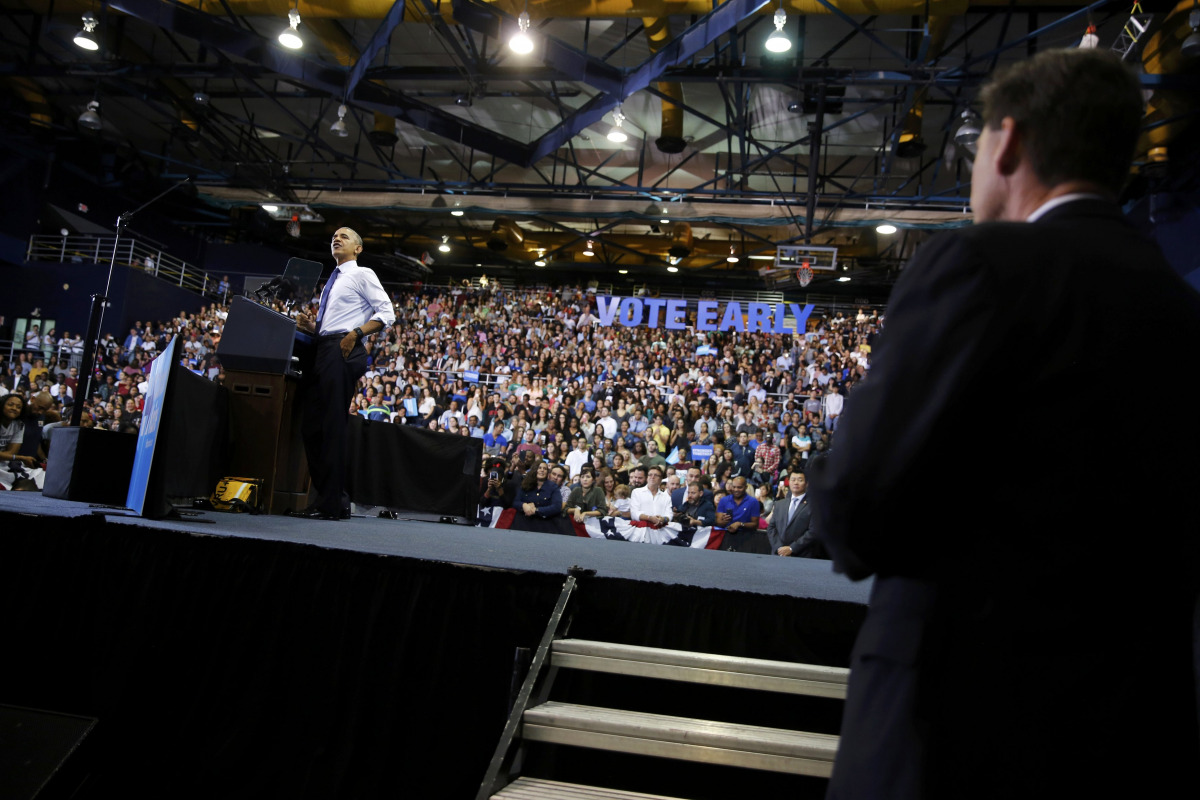 U.S. President Barack Obama (L) delivers remarks at a Hillary for America campaign event at Florida International University in Miami, Florida, U.S. November 3, 2016. REUTERS/Jonathan Ernst