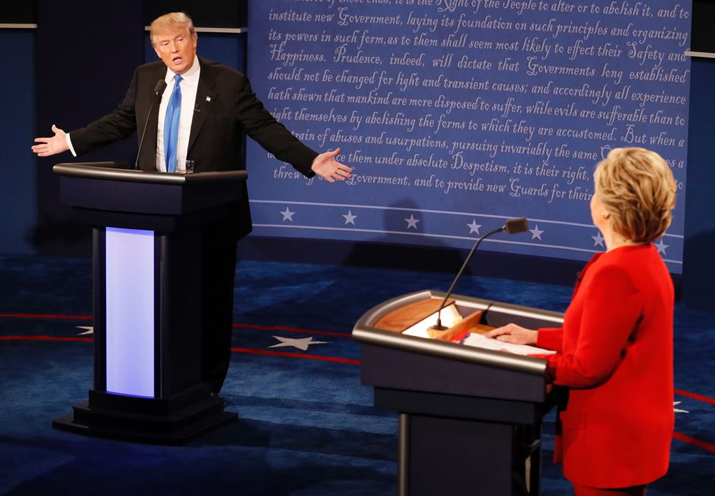 This file photo taken on September 26, 2016 shows Republican nominee Donald Trump (L) and Democratic nominee Hillary Clinton (R) during the first presidential debate at Hofstra University in Hempstead, New York. AFP / RICK WILKING 
