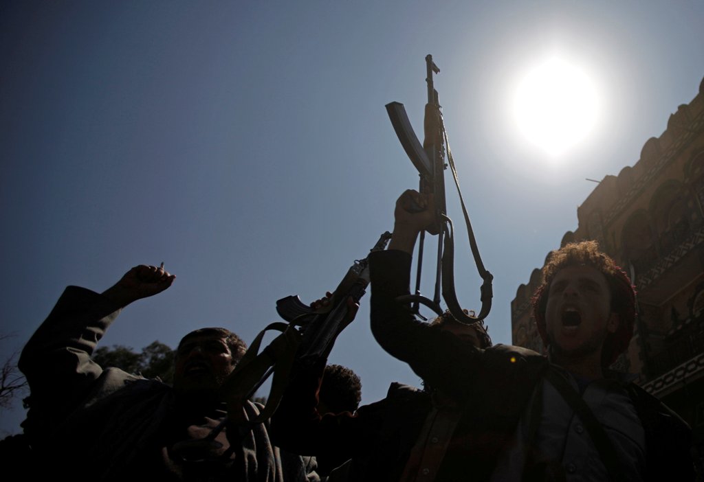 Pro-Houthi protesters wave their weapons as they shout slogans against a U.N.-proposed peace plan for Yemen during a demonstration outside a hotel where the U.N. envoy for Yemen, Ismail Ould Cheikh Ahmed, is staying in Sanaa, Yemen, November 5, 2016. REUT