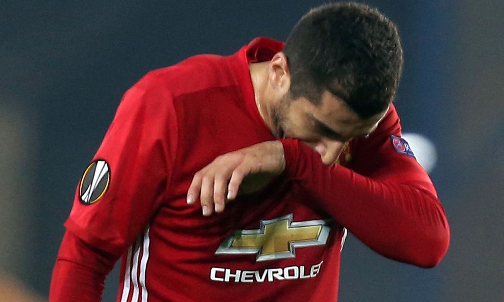 Manchester United's Armenian midfielder Henrikh Mkhitaryan reacts after the UEFA Europa League Group A football match Fenerbahce SK vs Manchester United at the Fenerbahce Ulker Stadium on November 3, 2016 in Istanbul. Fenerbahce won the match 2-1. / AFP /