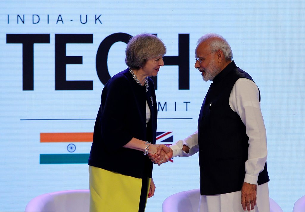 Britain's Prime Minister Theresa May shakes hands with her Indian counterpart Narendra Modi during the India-UK Tech Summit in New Delhi, India, November 7, 2016. REUTERS/Adnan Abidi
