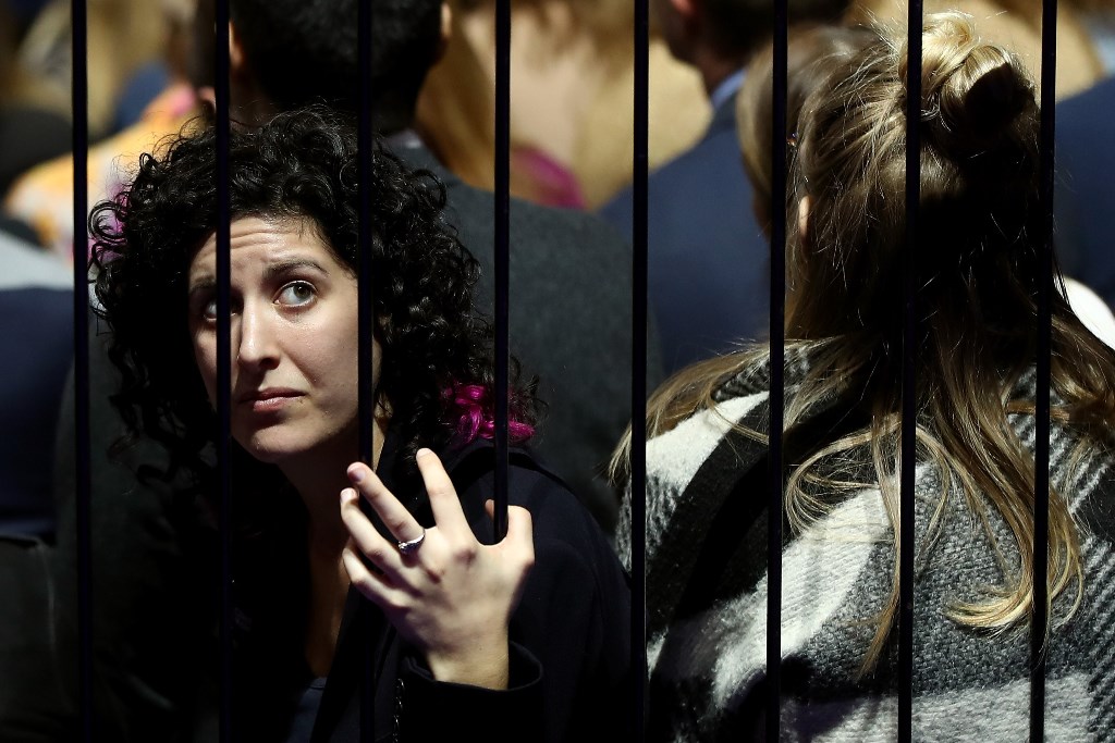 A woman watches voting results come in at Democratic presidential nominee former Secretary of State Hillary Clinton's election night event at the Jacob K. Javits Convention Center November 8, 2016 in New York City. Elsa/Getty Images/AFP