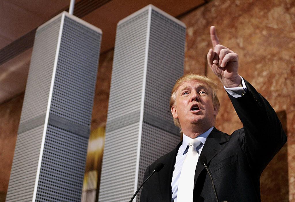 (FILES) This file photo taken on May 18, 2005 shows Real estate developer Donald Trump holding a news conference at Trump Tower, standing next to a nine-foot model of his proposed Twin Towers II, an alternative to the Freedom Tower design that was approve