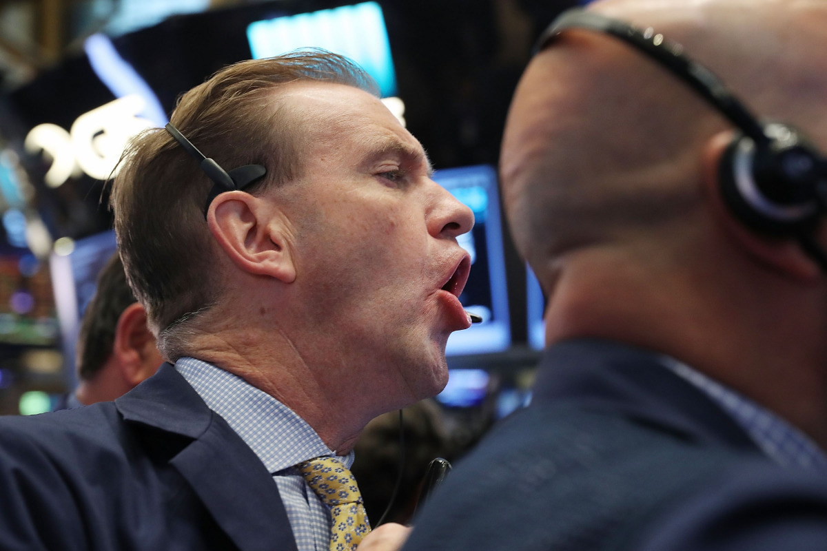 Traders work on the floor of the New York Stock Exchange (NYSE) the morning after Donald Trump won a major upset in the presidential election on November 9, 2016 in New York City. Global markets originally dropped after Trump began to pull ahead of his ri