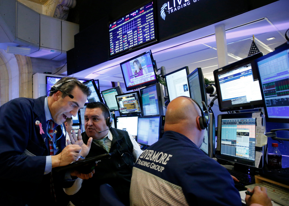 Traders work on the floor of the New York Stock Exchange (NYSE) the morning after the U.S. presidential election in New York City, U.S., November 9, 2016. REUTERS/Brendan McDermid