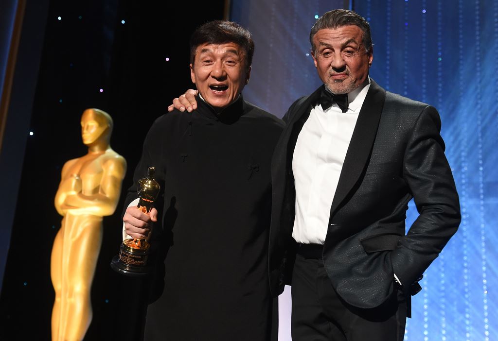 Honoree Jackie Chan (L) poses with actor Sylvester Stallone after Chan accepted his Honorary Oscar Award during the 8th Annual Governors Awards hosted by the Academy of Motion Picture Arts and Sciences at the Hollywood & Highland Center in Hollywood, Cali