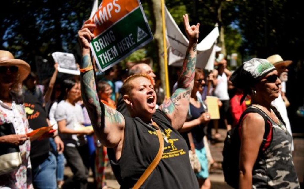 People march in an event organised by Doctors for Refugees to demand humane treatment for Manus refugees. PETER PARKS/AFP