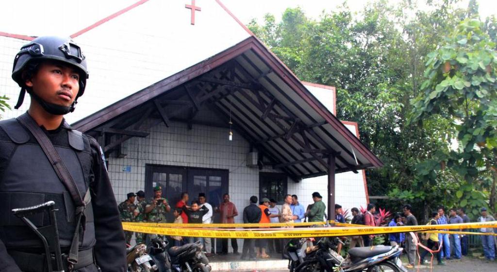 Toddlers were playing in the parking area of the church, on Borneo island, when a man threw bombs from his motorbike. (Photo: AFP)