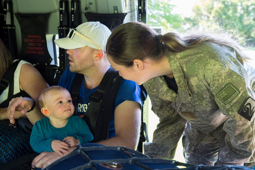 A Royal New Zealand Air Force member (R) helps evacuate a toddler and others aboard an NH90 helicopter from Kaikoura on the South Island of New Zealand November 15, 2016, stranded following the recent earthquakes. Sgt Sam Shepherd/Courtesy of Royal New Ze