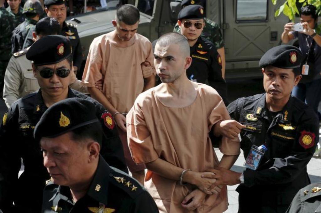 Suspects of the August 17 Bangkok blast, Bilal Mohammed (also known as Adem Karadag) and Yusufu Mieraili are escorted as they arrive at the military court in Bangkok, Thailand, November 24, 2015. REUTERS/Chaiwat Subprasom/File Photo