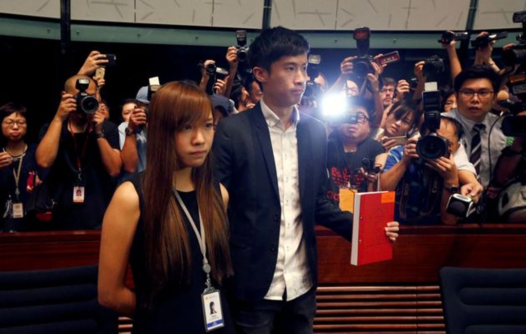 Pro-independence lawmakers Yau Wai-ching and Baggio Leung stand during a demonstration at the Legislative Council in Hong Kong. BOBBY YIP / REUTERS