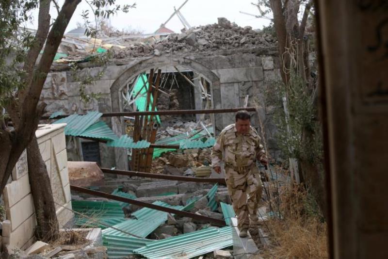 A Yazidi man inspects a temple destroyed by the Islamic State militants in the town of Bashiqa, after it was recaptured from the Islamic State, east of Mosul, Iraq November 10, 2016. REUTERS/Alaa Al-Marjani