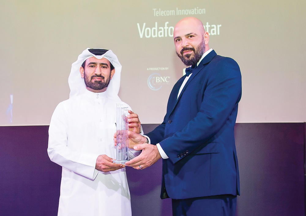 Mohammed Al Yami (left), Director of External Affairs, Vodafone Qatar, receiving the award. 