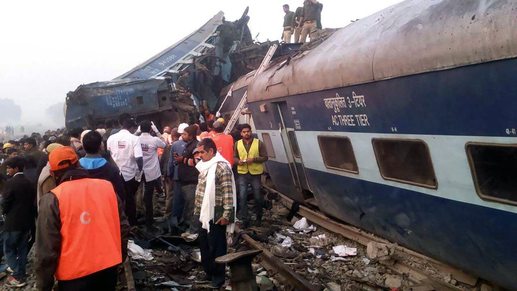 Indian rescue workers search for survivors in the wreckage of a train that derailed near Pukhrayan in Kanpur district on November 20, 2016. AFP 