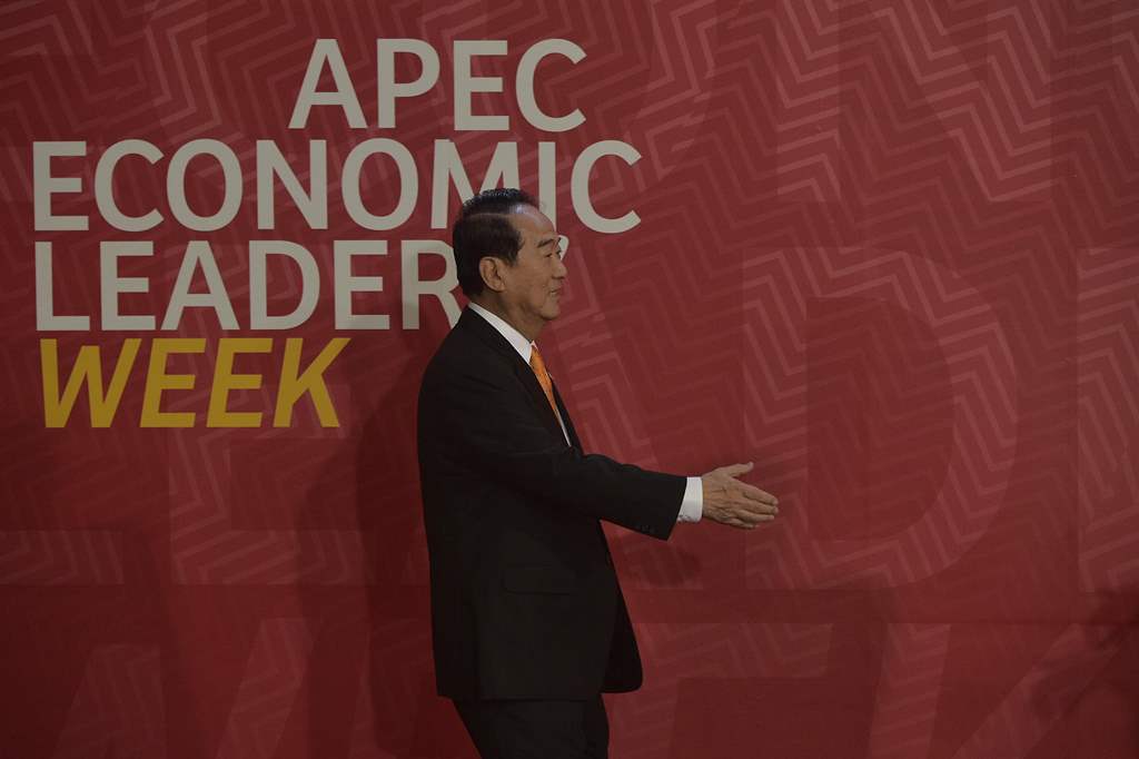 Taiwan's representative James Soong reaches out to shake hands with Peru's President Pedro Pablo Kuczynski (not pictured) as he arrives at the Lima Convention Centre for the APEC Leaders' Retreat on the last day of the Asia-Pacific Economic Cooperation (A