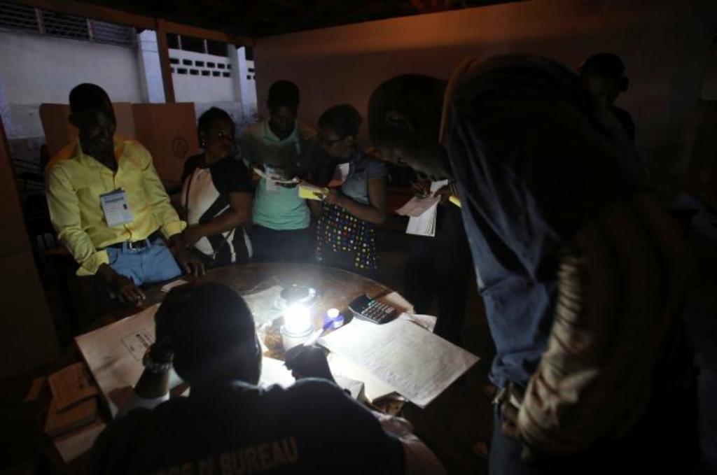 Electoral workers are seen during vote counting at a polling station as Haiti holds a long-delayed presidential election after a devastating hurricane and more than a year of political instability, in Port-au-Prince, Haiti, November 20, 2016. REUTERS/Jean